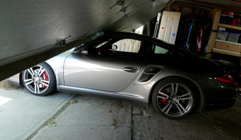 Car Crash Son Launches Porsche Turbo Press Car Through Garage Door 01