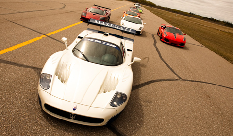 Maserati MC12 being chased down the runway by its competition